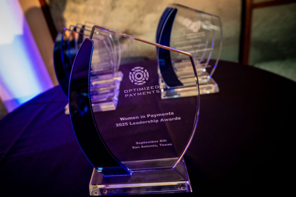 Awards displayed at the Optimized Payments Women in Payments 2025 Leadership Awards event, highlighting achievements in reducing credit card processing fees and enhancing payment solutions.